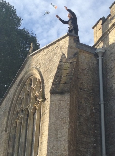 Father Aran launches the parachutes from the church roof